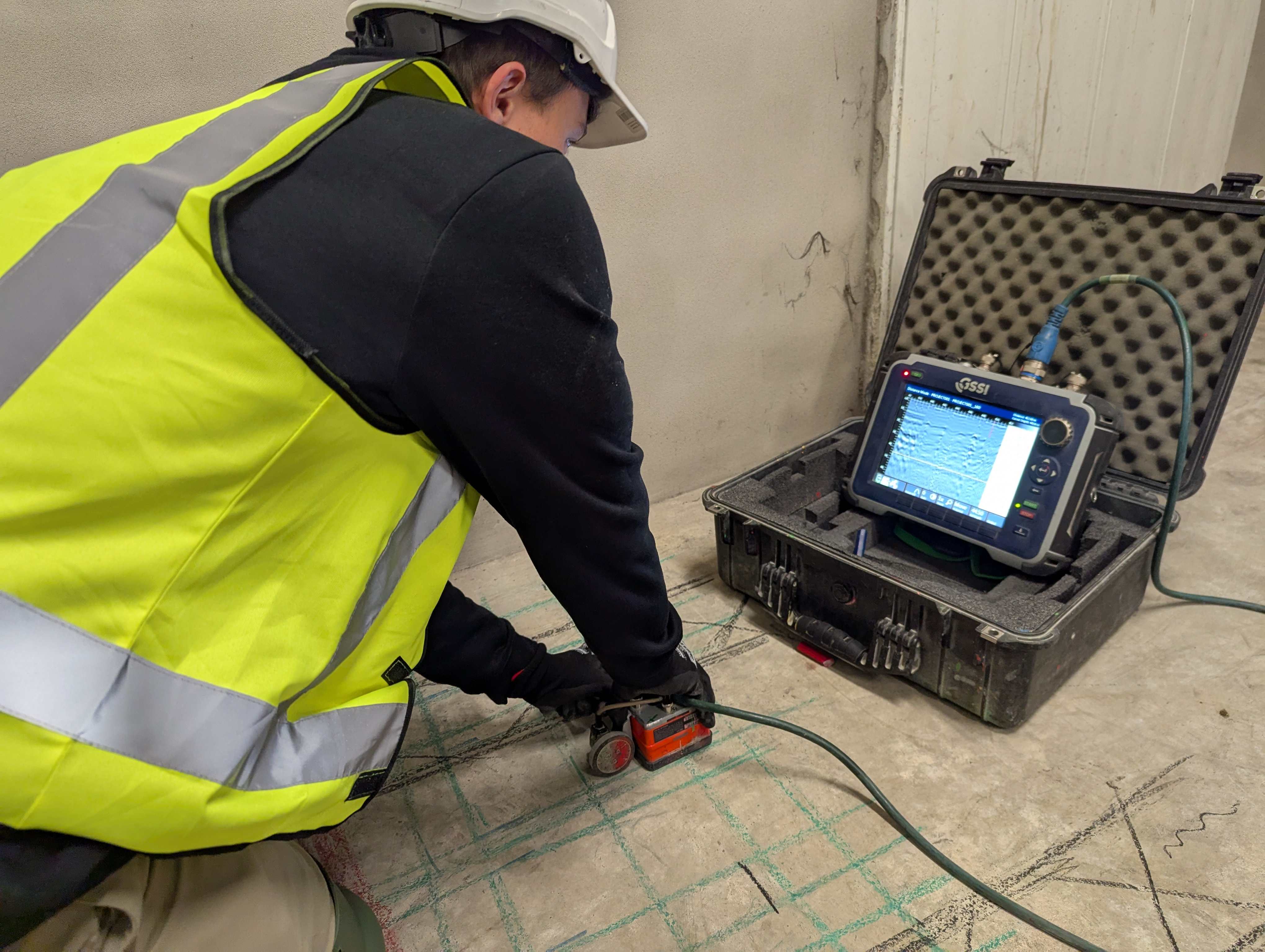 Professional technician using GPR equipment for concrete scanning